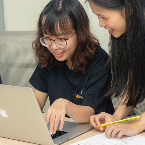 students looking at laptop