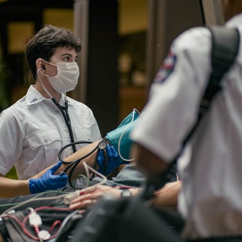 EMT taking a patient's blood pressure